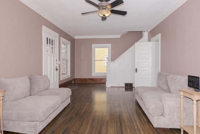 living area featuring baseboards, dark wood finished floors, a ceiling fan, and crown molding