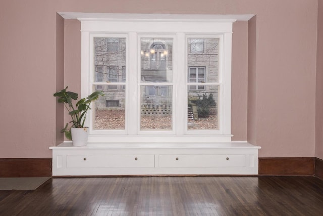 interior space with dark wood-style floors and baseboards