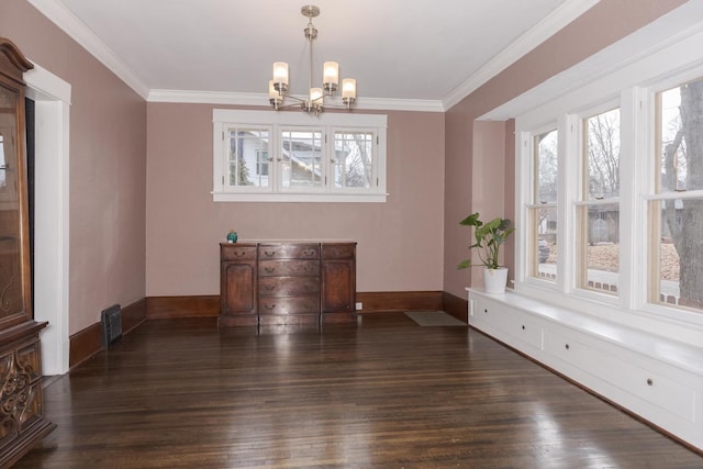 dining area with ornamental molding, dark wood-style flooring, and a wealth of natural light