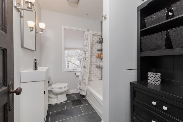 bathroom featuring toilet, shower / tub combo, vanity, baseboards, and tile patterned floors