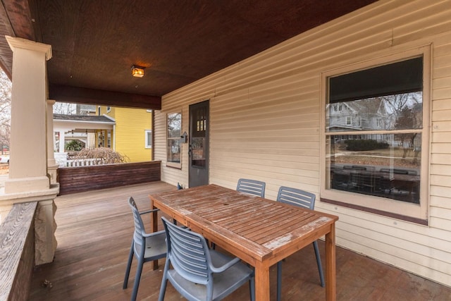 view of patio with a porch and outdoor dining space