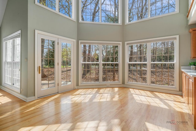 unfurnished sunroom featuring french doors