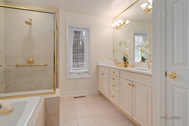 bathroom with tile patterned flooring, double vanity, a relaxing tiled tub, a sink, and tiled shower