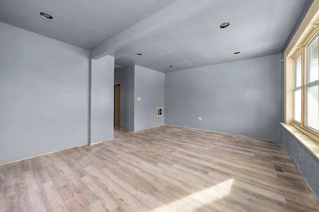 spare room featuring light hardwood / wood-style floors