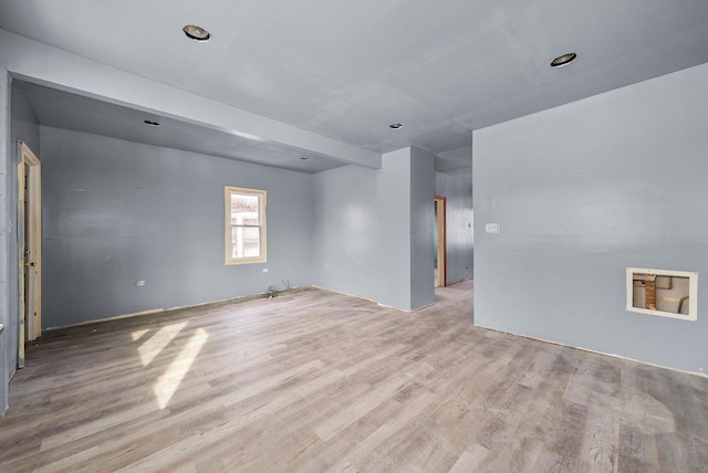 spare room featuring light wood-type flooring