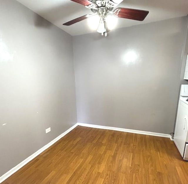 empty room featuring hardwood / wood-style flooring and ceiling fan