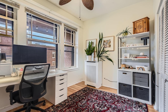 office area with ceiling fan and light wood-type flooring