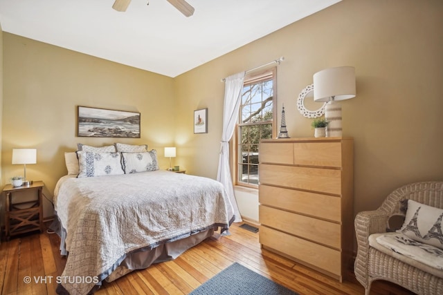 bedroom with hardwood / wood-style floors and ceiling fan