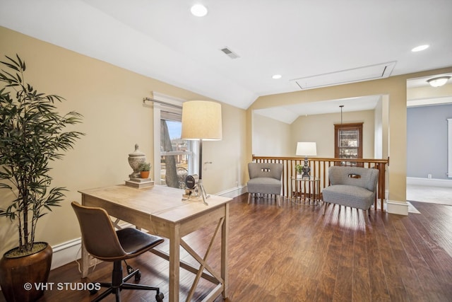 office featuring lofted ceiling and dark hardwood / wood-style flooring