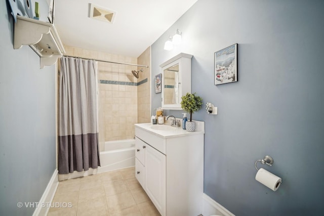 bathroom featuring tile patterned floors, shower / bathtub combination with curtain, and vanity