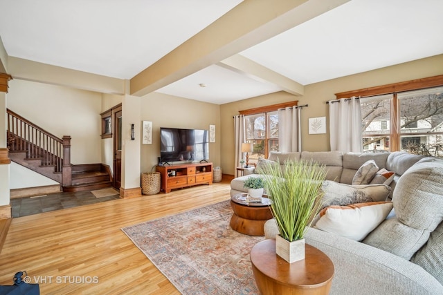 living room with hardwood / wood-style floors and beamed ceiling