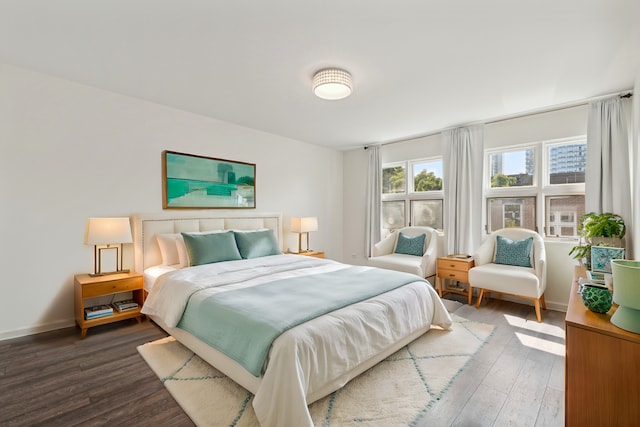 bedroom featuring dark hardwood / wood-style flooring