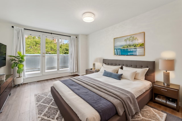 bedroom with hardwood / wood-style floors