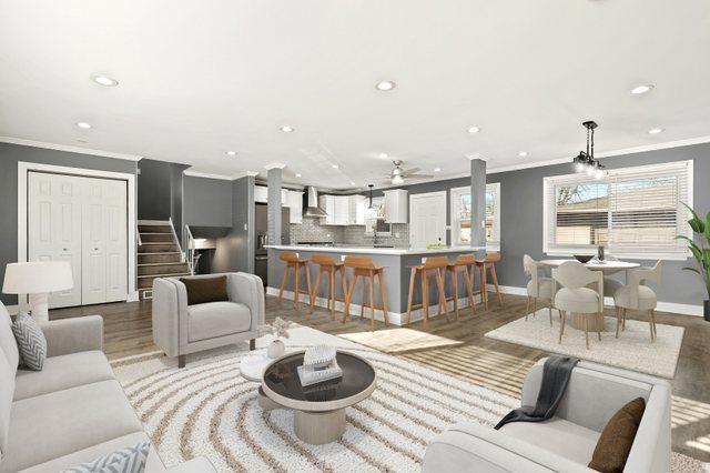 living room featuring crown molding and hardwood / wood-style flooring