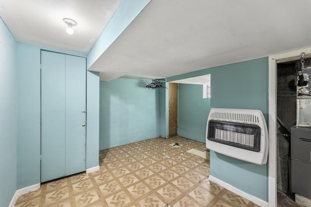 interior space with heating unit and light parquet floors