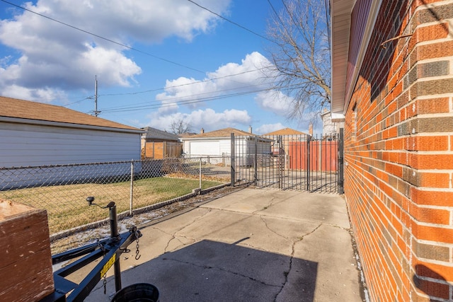 view of patio featuring a garage and an outdoor structure