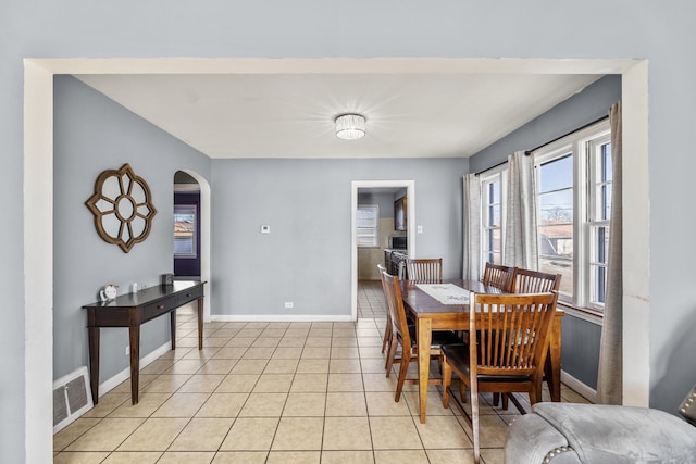 dining area featuring light tile patterned flooring