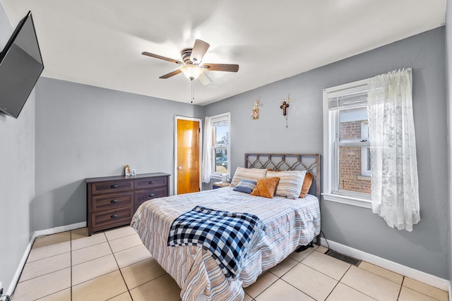 bedroom featuring light tile patterned floors and ceiling fan