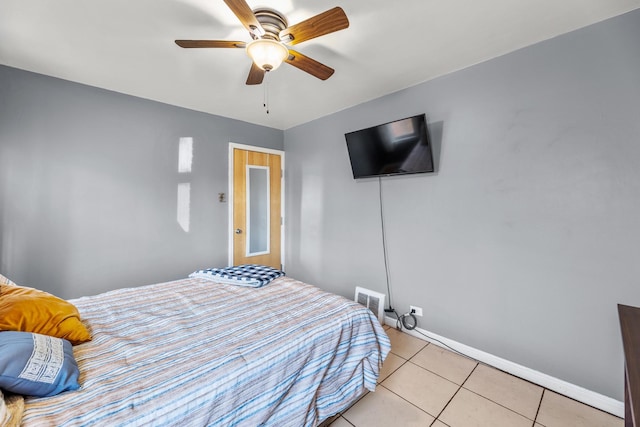 bedroom featuring ceiling fan and light tile patterned floors