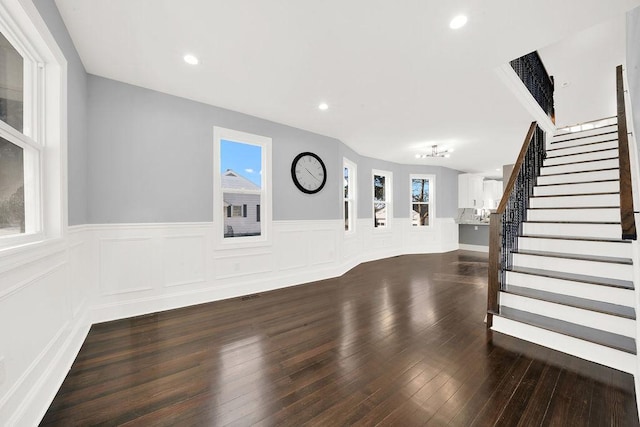 unfurnished living room featuring dark hardwood / wood-style flooring