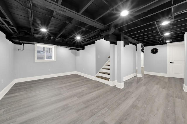 basement with wood-type flooring