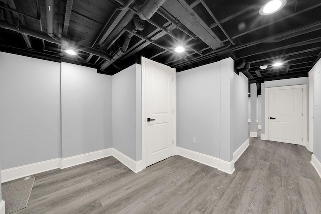 basement with wood-type flooring