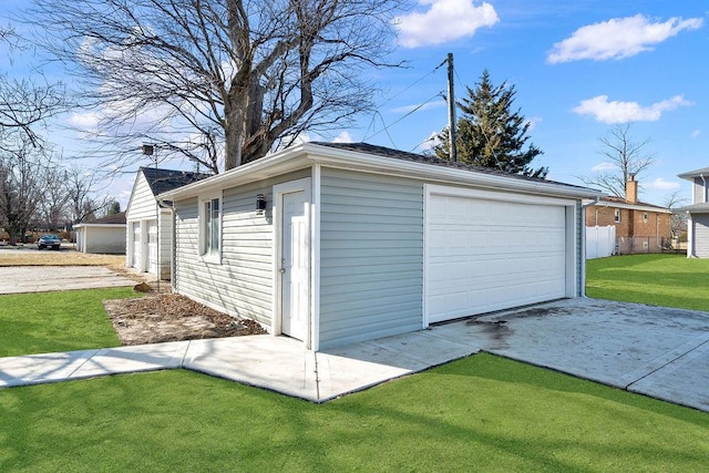 garage with a lawn