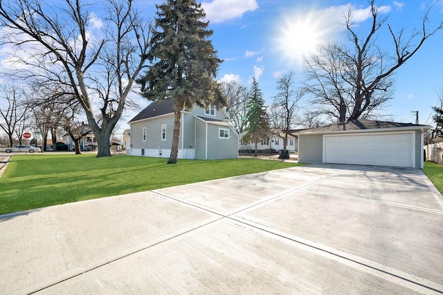 view of side of home featuring a garage and a yard