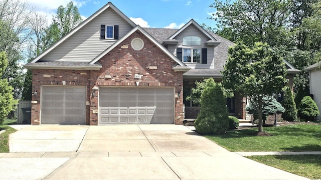 26357 S Lyndsay Dr, Channahon, IL 60410 - view of front of house featuring concrete driveway, brick siding, roof with shingles, and a front yard