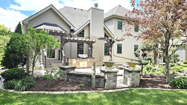 26357 S Lyndsay Dr, Channahon, IL 60410 - back of house featuring a pergola, roof with shingles, a chimney, a patio, and entry steps