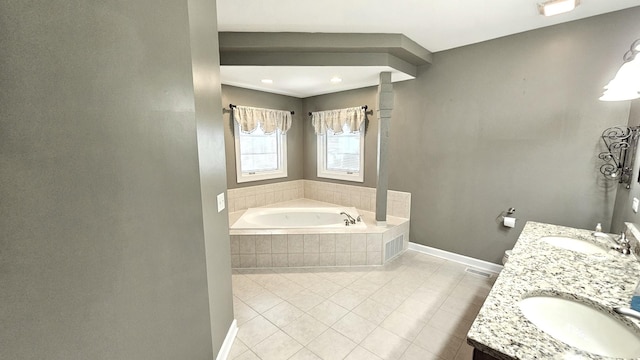 26357 S Lyndsay Dr, Channahon, IL 60410 - bathroom with baseboards, a bath, double vanity, and tile patterned floors