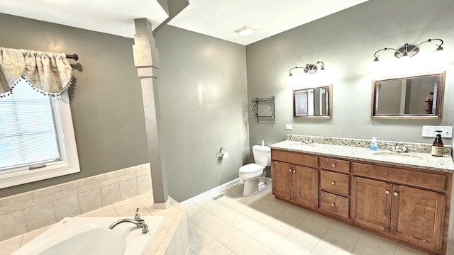 26357 S Lyndsay Dr, Channahon, IL 60410 - bathroom with double vanity, a garden tub, toilet, baseboards, and tile patterned flooring