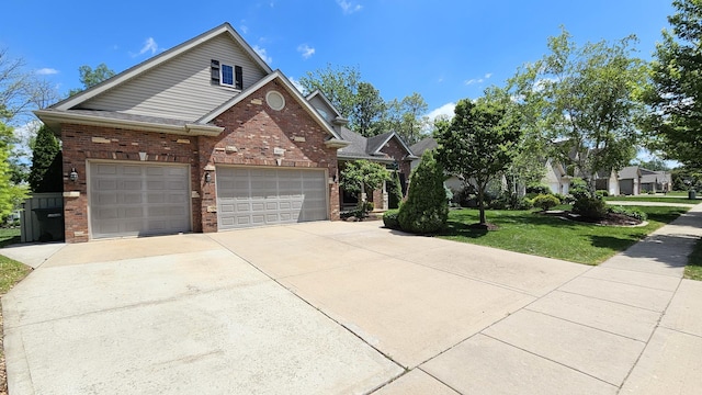 26357 S Lyndsay Dr, Channahon, IL 60410 - view of front of house featuring brick siding, driveway, and a front lawn