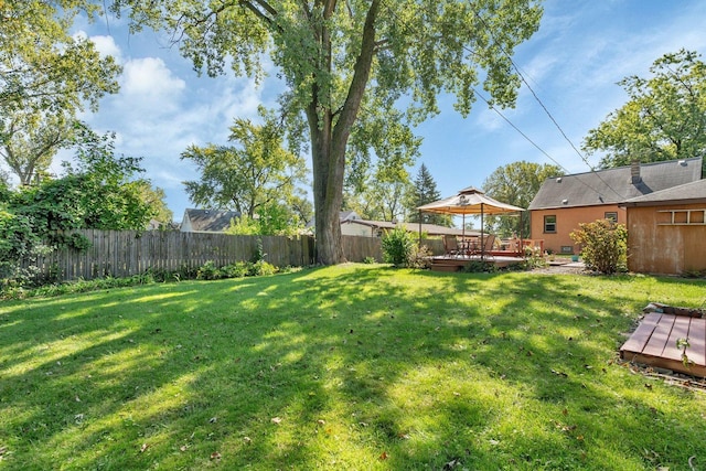 view of yard with a gazebo and a deck