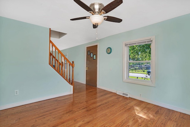 unfurnished room featuring ceiling fan and light wood-type flooring