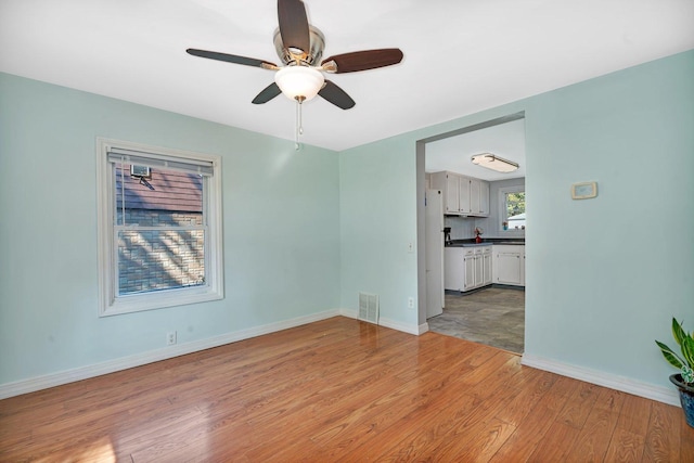 interior space featuring ceiling fan and light hardwood / wood-style flooring