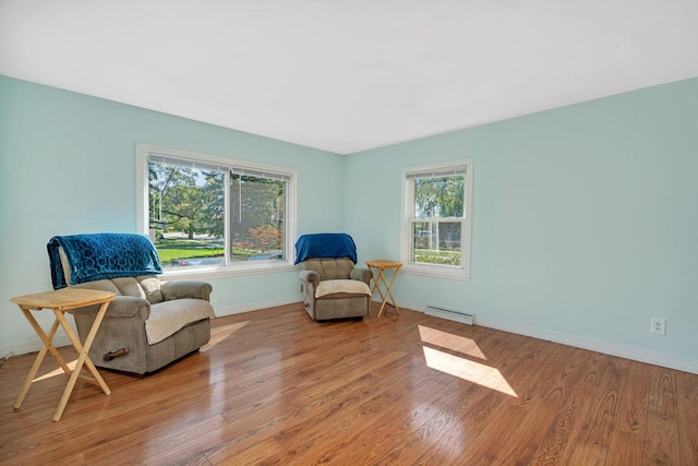 sitting room with light hardwood / wood-style flooring and baseboard heating