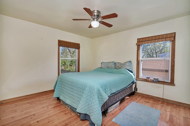 bedroom featuring light hardwood / wood-style flooring and ceiling fan