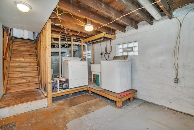 basement featuring washing machine and clothes dryer