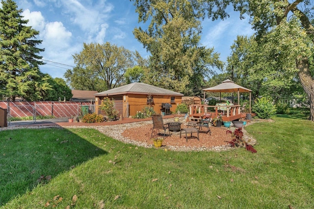 view of yard with a gazebo and a fire pit