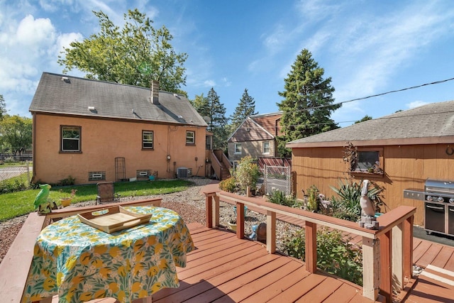 wooden deck featuring central air condition unit