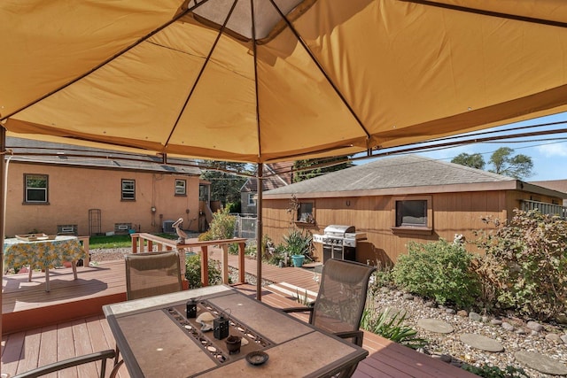 deck with a gazebo, a grill, and an outdoor fire pit