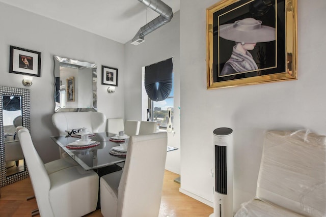 dining area with hardwood / wood-style floors