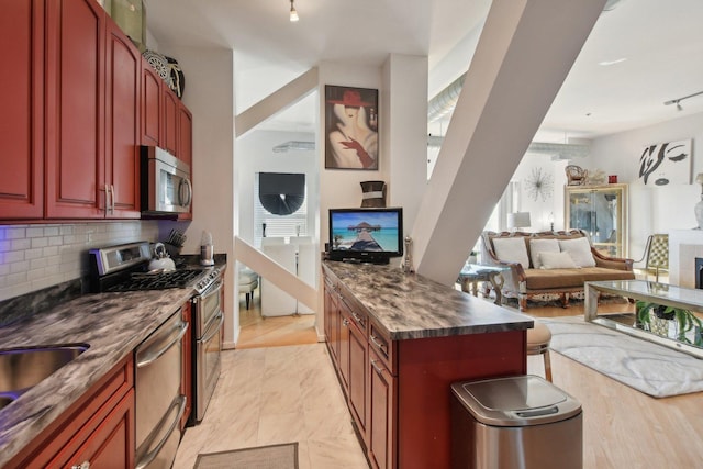 kitchen featuring decorative backsplash and stainless steel appliances