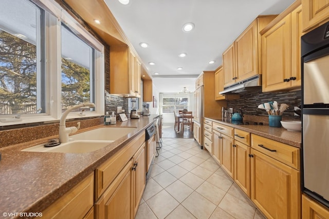 kitchen featuring tasteful backsplash, dishwasher, sink, fridge, and light tile patterned floors