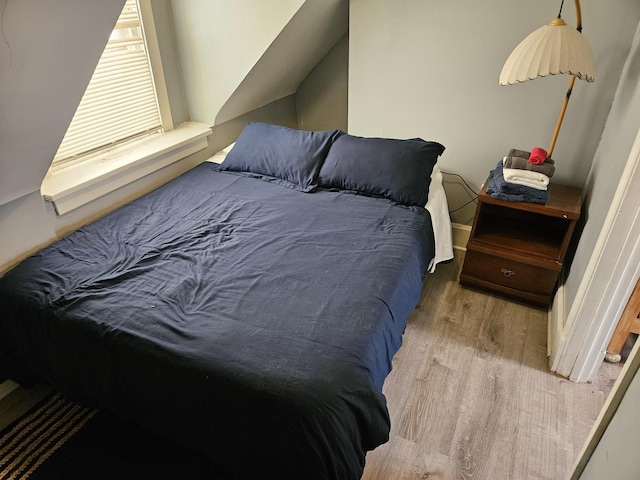 bedroom featuring light wood-type flooring