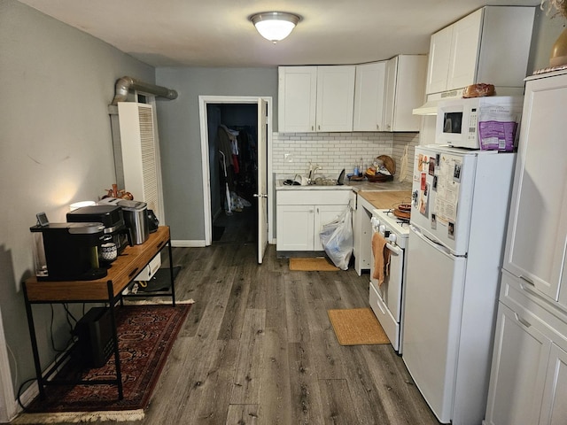 kitchen featuring white cabinetry, dark wood-type flooring, white appliances, and decorative backsplash