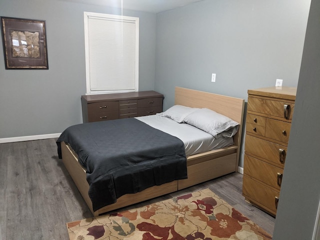 bedroom with hardwood / wood-style floors