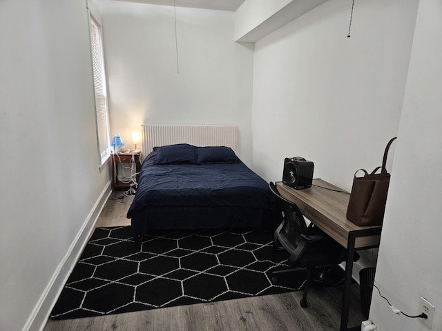 bedroom with hardwood / wood-style flooring