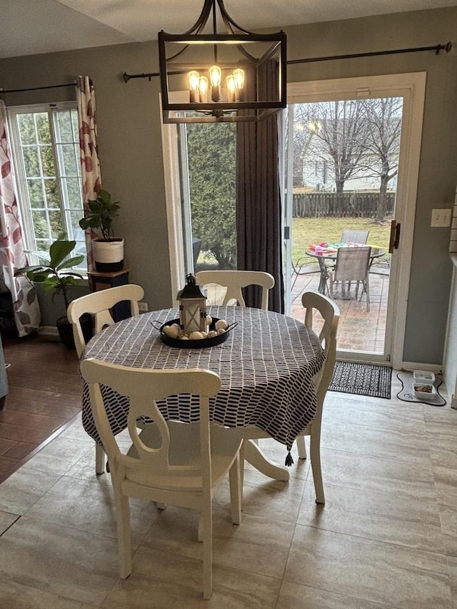 dining room with a notable chandelier